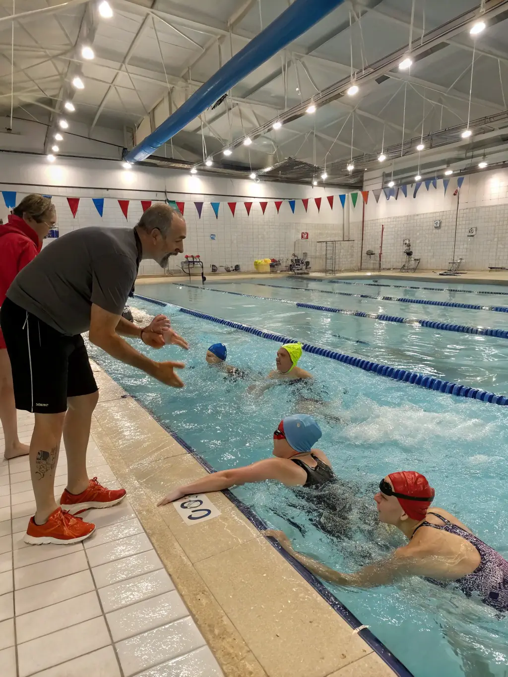 A group of teacher trainees participating in a water rescue training exercise, highlighting the comprehensive nature of the program.